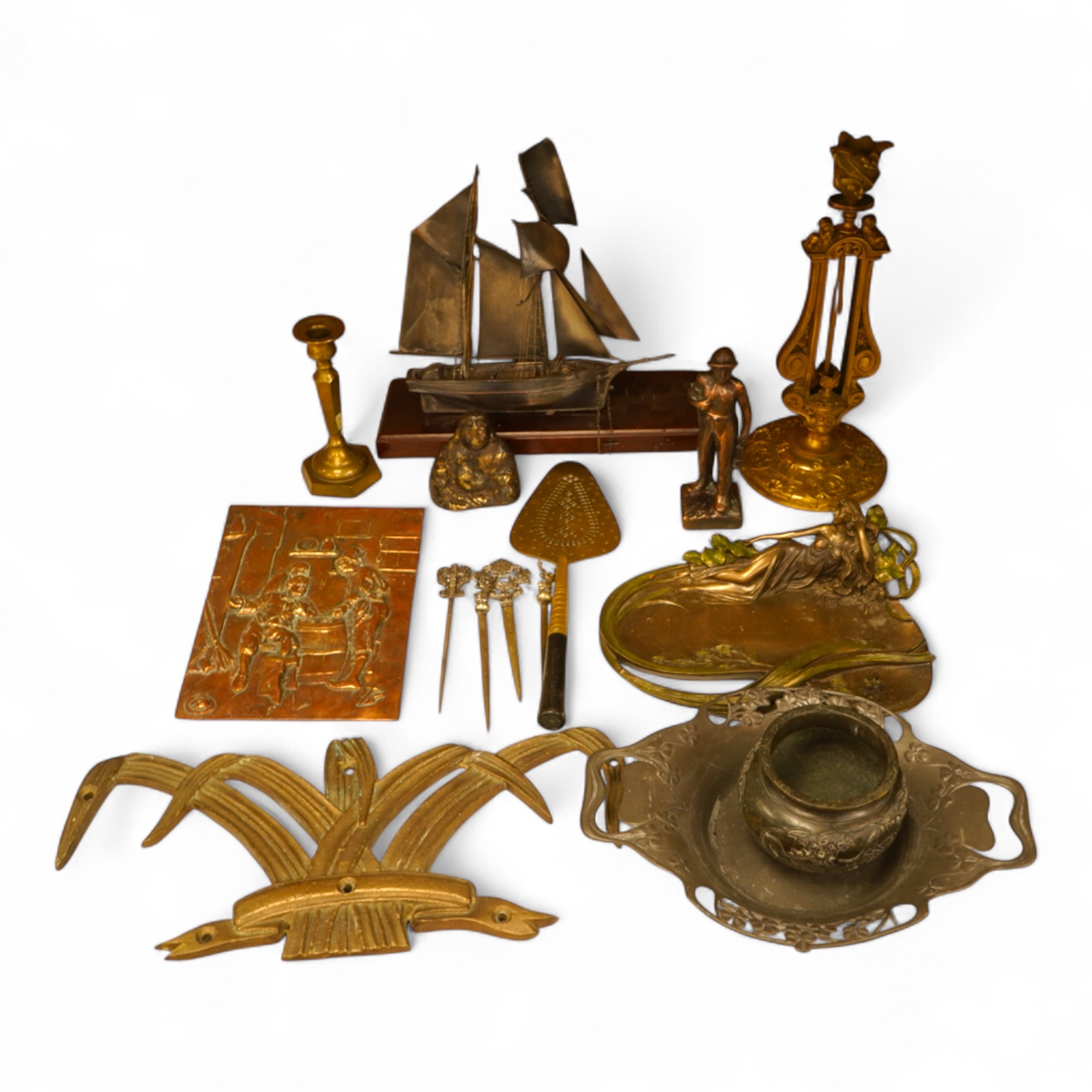 A mixed group of metalware including an Art Nouveau figural dish and pewter dish, a candlestick etc